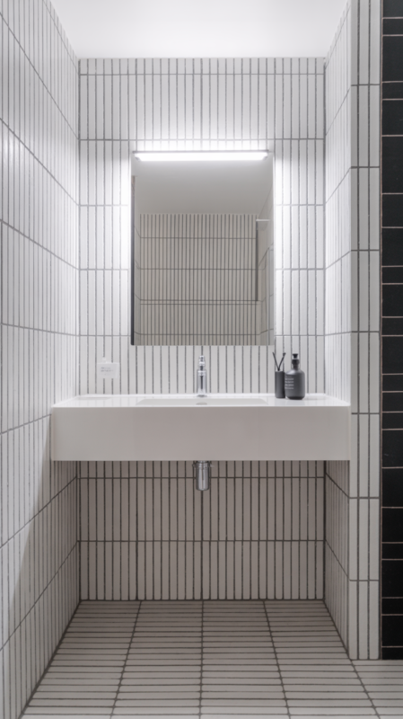 Vertical stacked tile bathroom backsplash installation creating height illusion in small bathroom